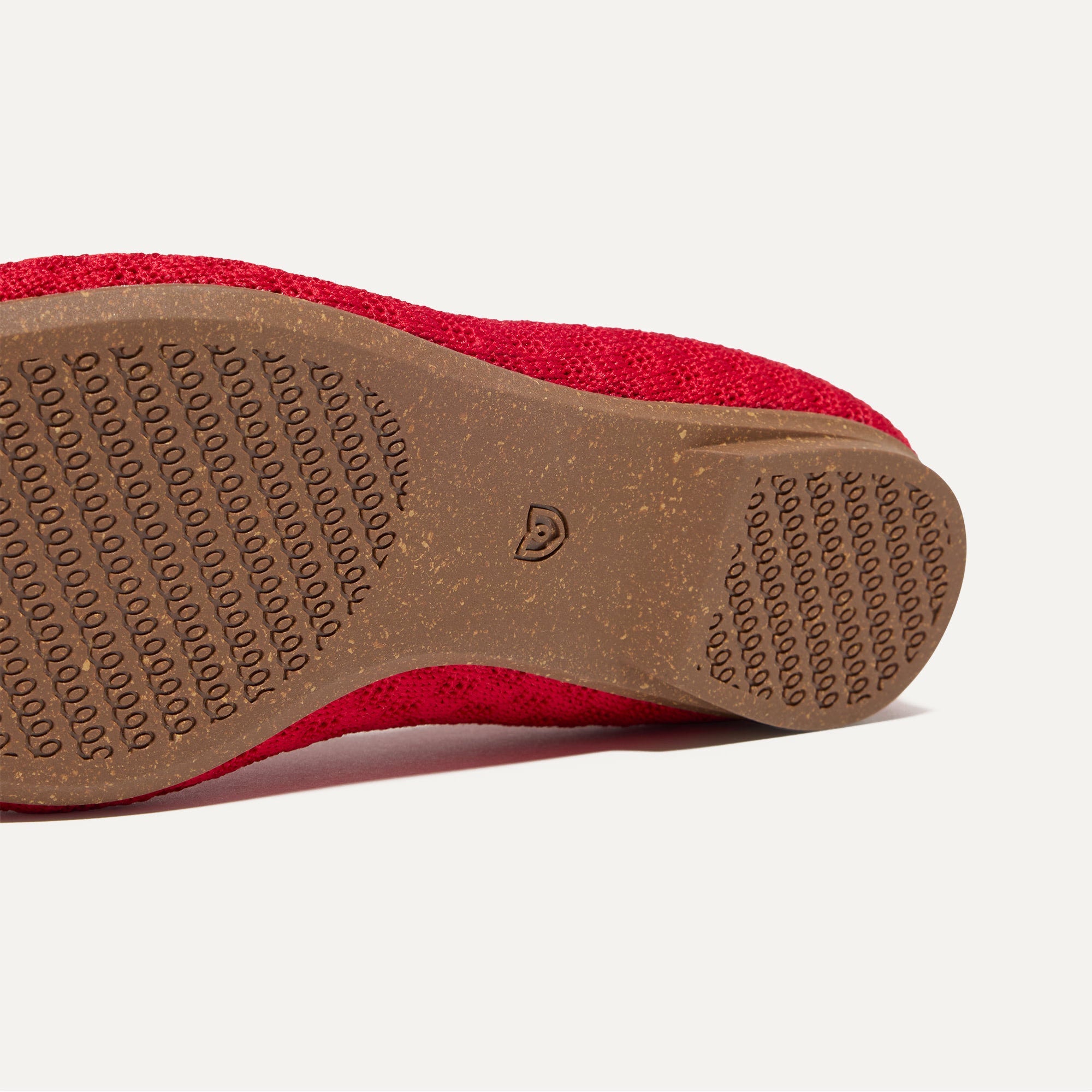 The sole of The Max Square Mary Jane in Red Crisp Basketweave shown in diagonal view.