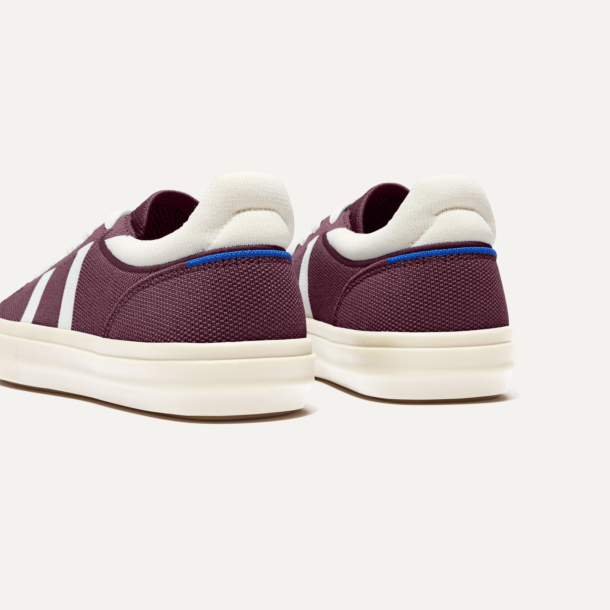 Close up of the heel of The RS02 Sneaker Burgundy Blitz, with the padded ankle collar and Rothy's signature blue halo. 