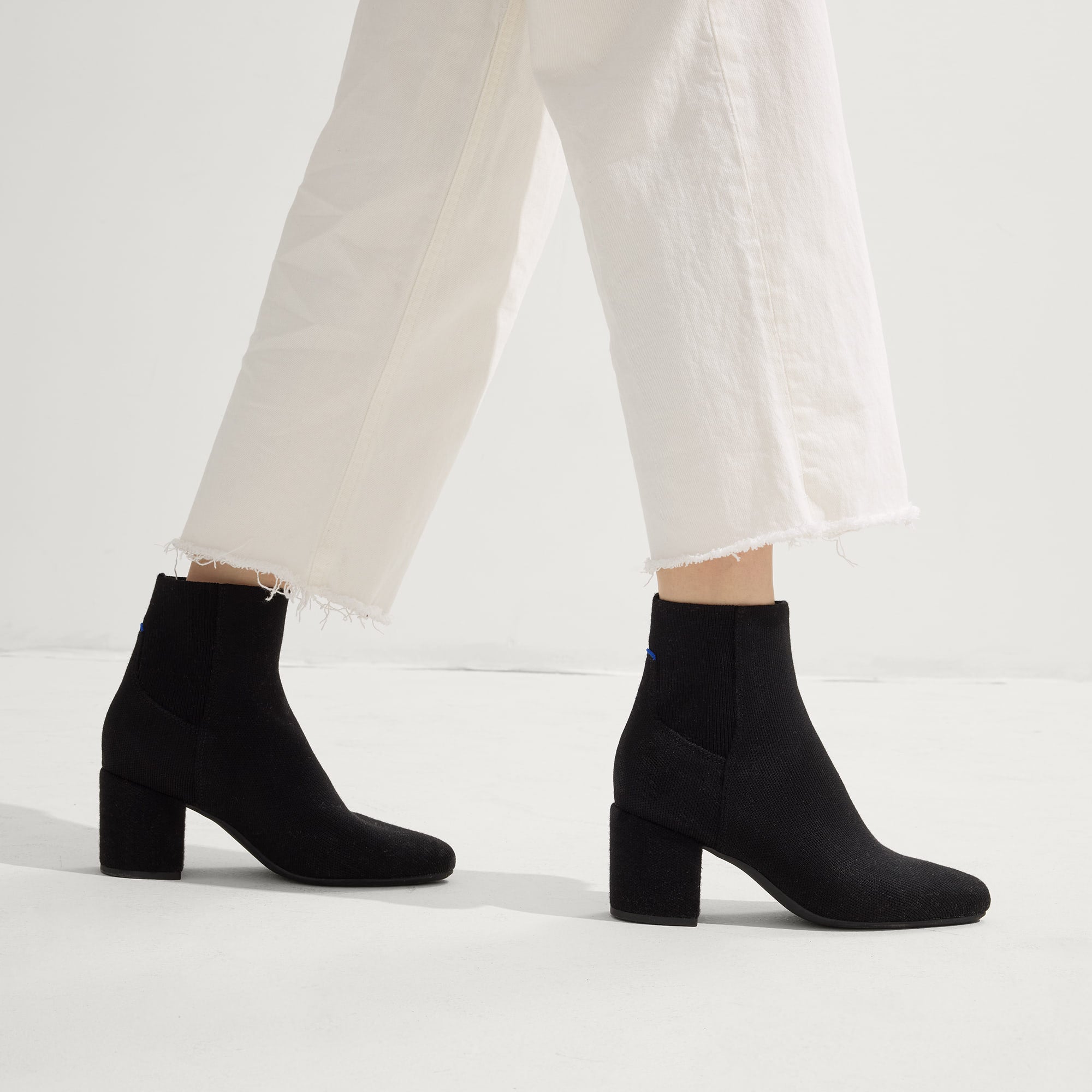 hover | Model wearing The High Classic Boot in Black.