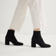 hover | Model wearing The High Classic Boot in Black.